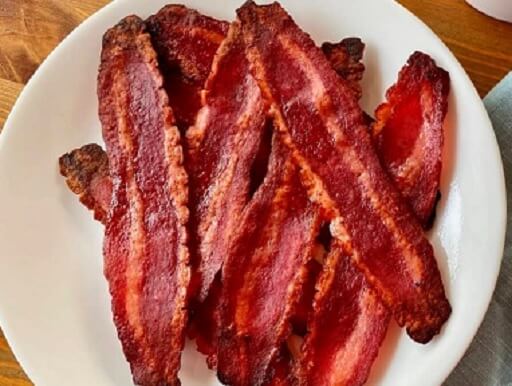 Some slices of microwaved turkey bacon